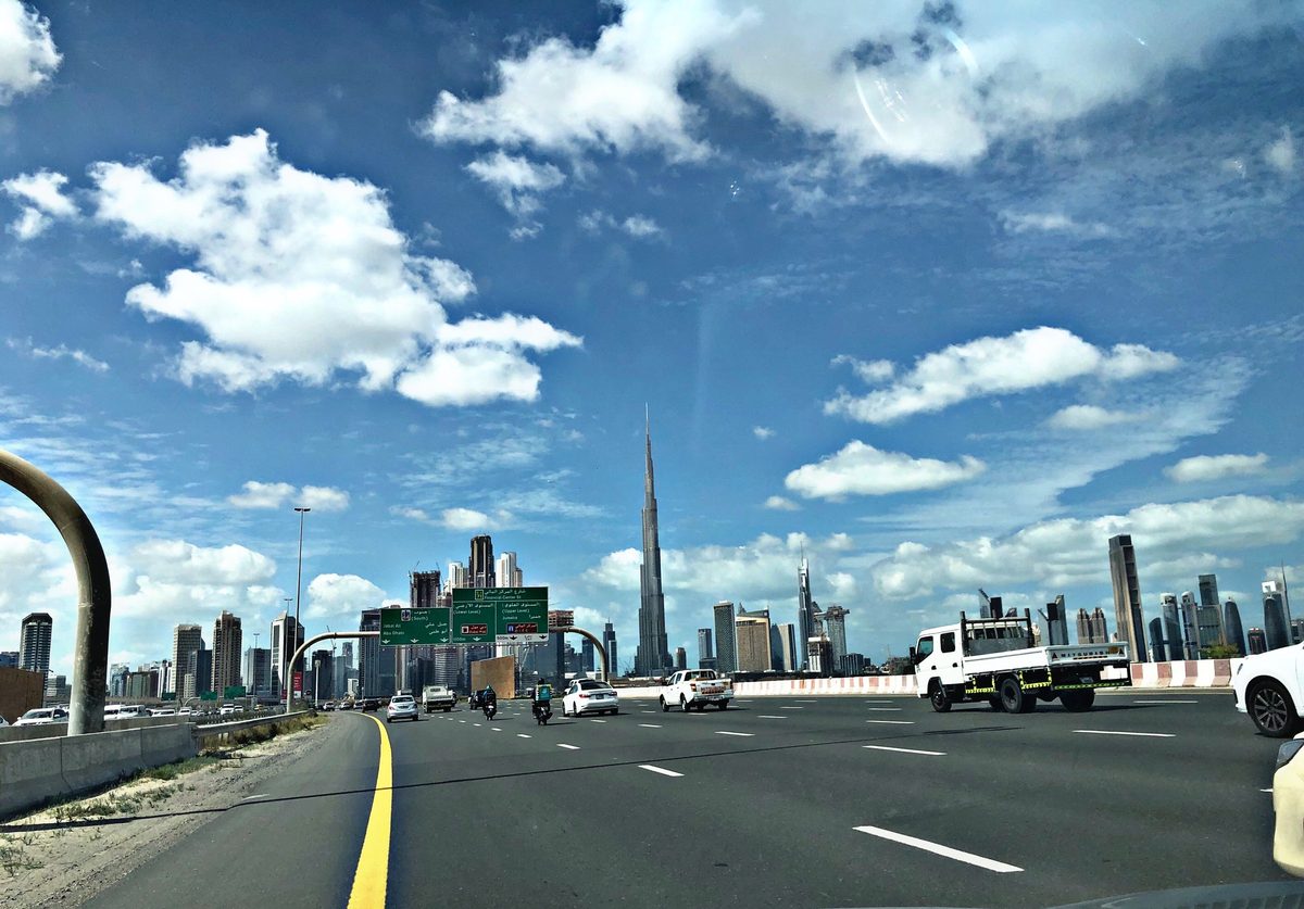Al Khail Road seen from a car in the morning, the Downtown Dubai skyline ahead