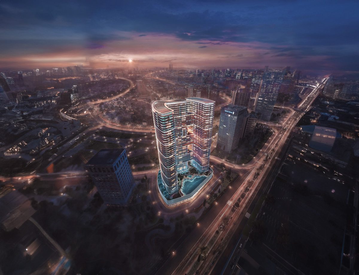 Developer's night render of Binghatti Hills from the air: a curved tower with a lit pool deck at its foot, the road grid of Al Barsha South around it