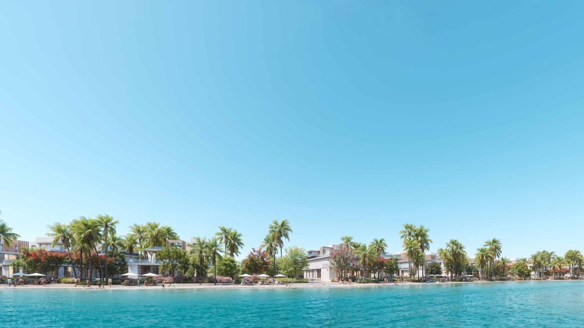 The lagoon at DAMAC Islands: still turquoise water, then villas, parasols and bathers along the palm-lined far shore, from the developer's brochure