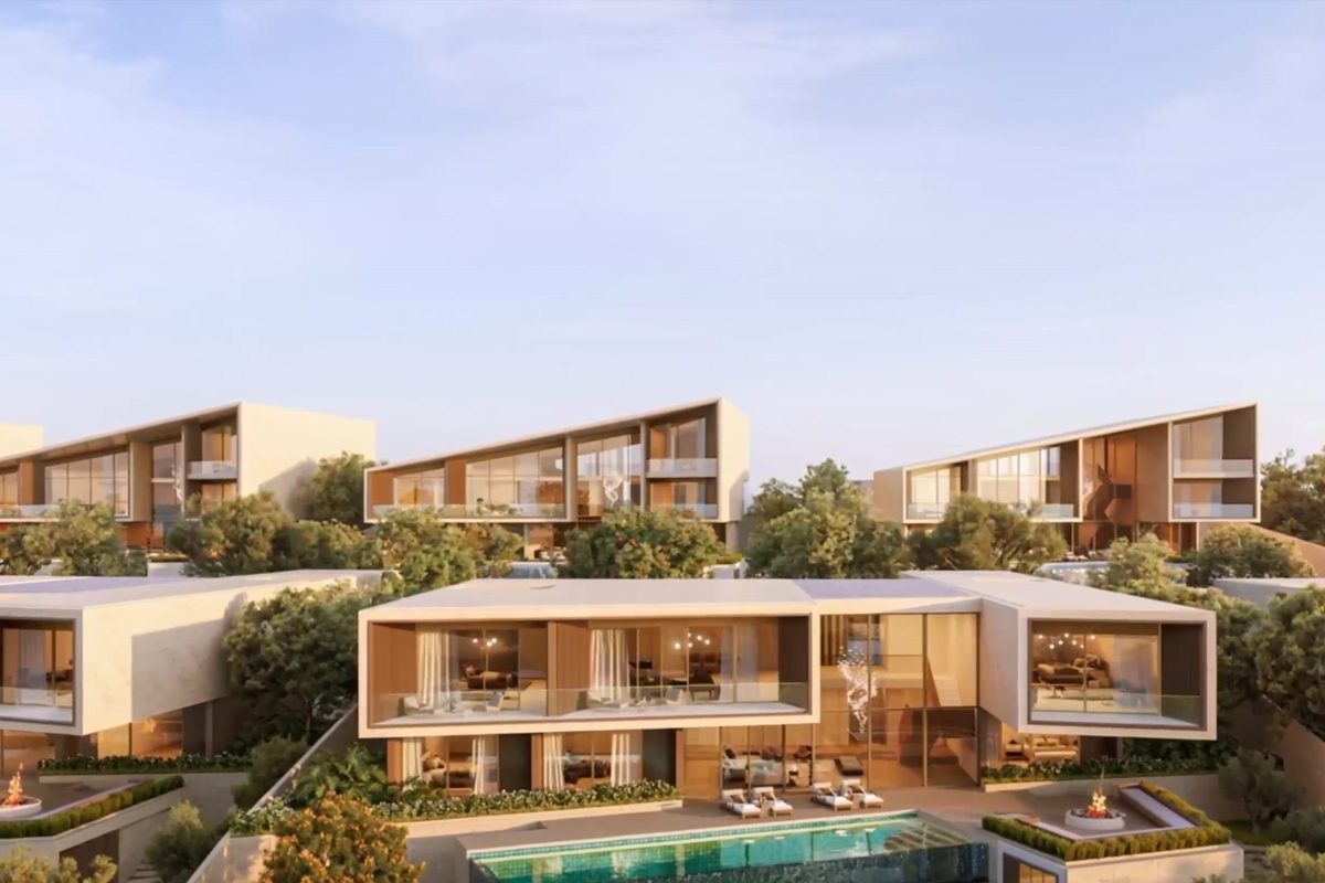 Contemporary villas stepping down a landscaped hillside, each with a terrace, a pool in front, in warm evening light